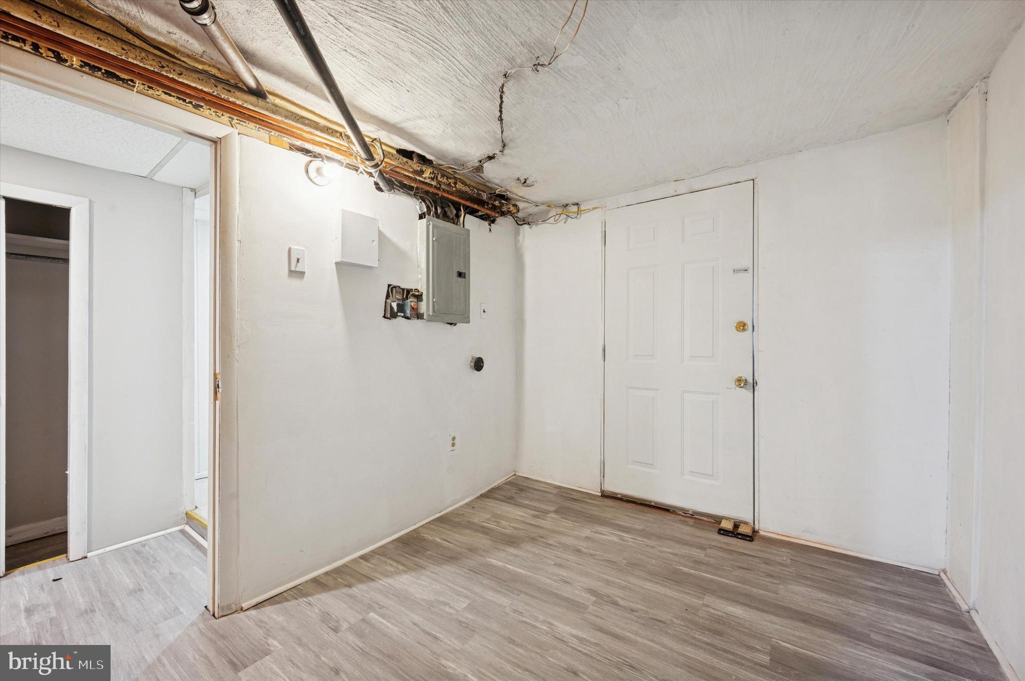 6619 Guyer Avenue, Unit 1 Philadelphia, PA 19142 - Photo 14 of 16 a view of a room with wooden floor