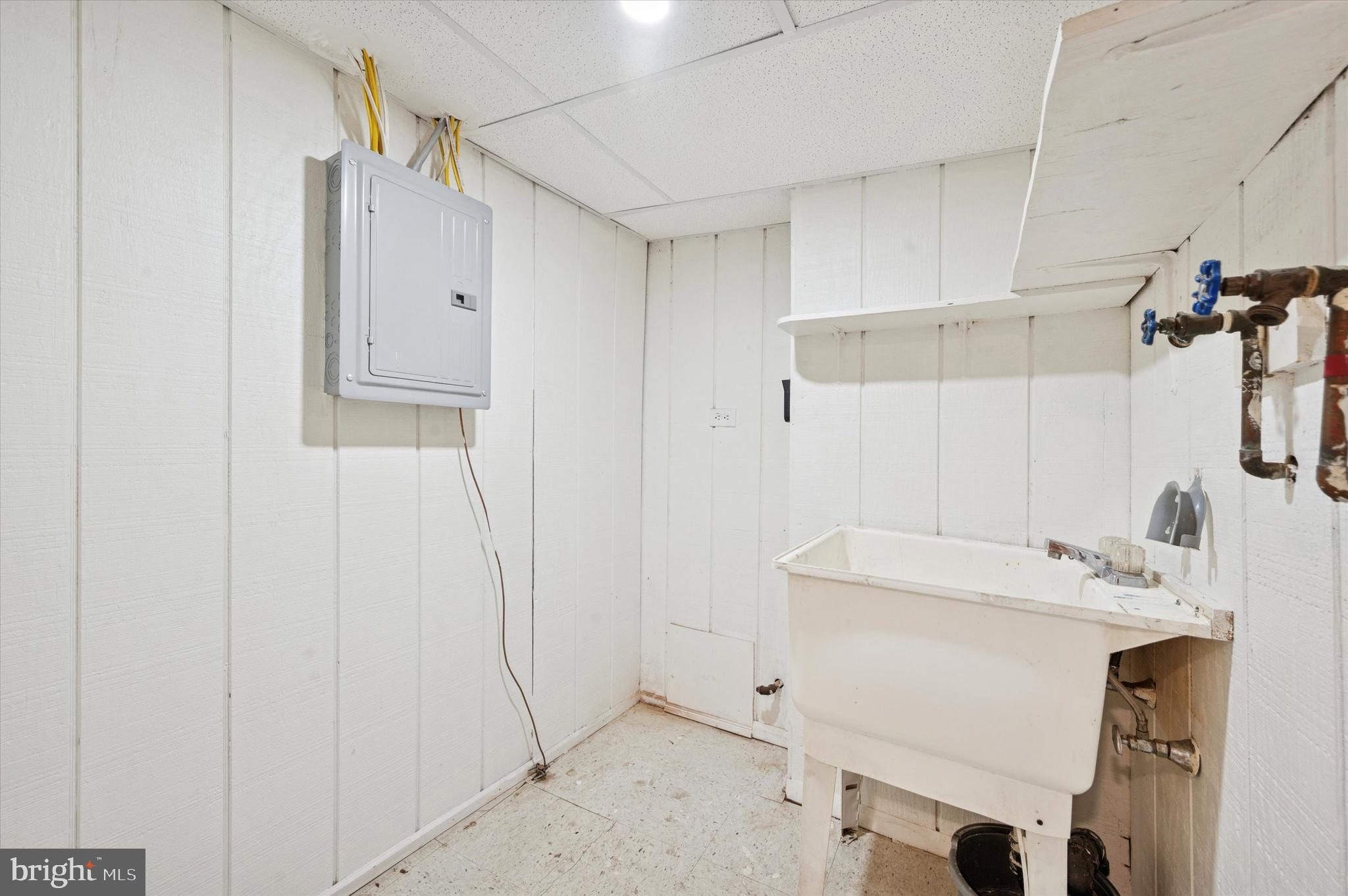 6619 Guyer Avenue, Unit 1 Philadelphia, PA 19142 - Photo 15 of 16 a bathroom with a sink and a shower