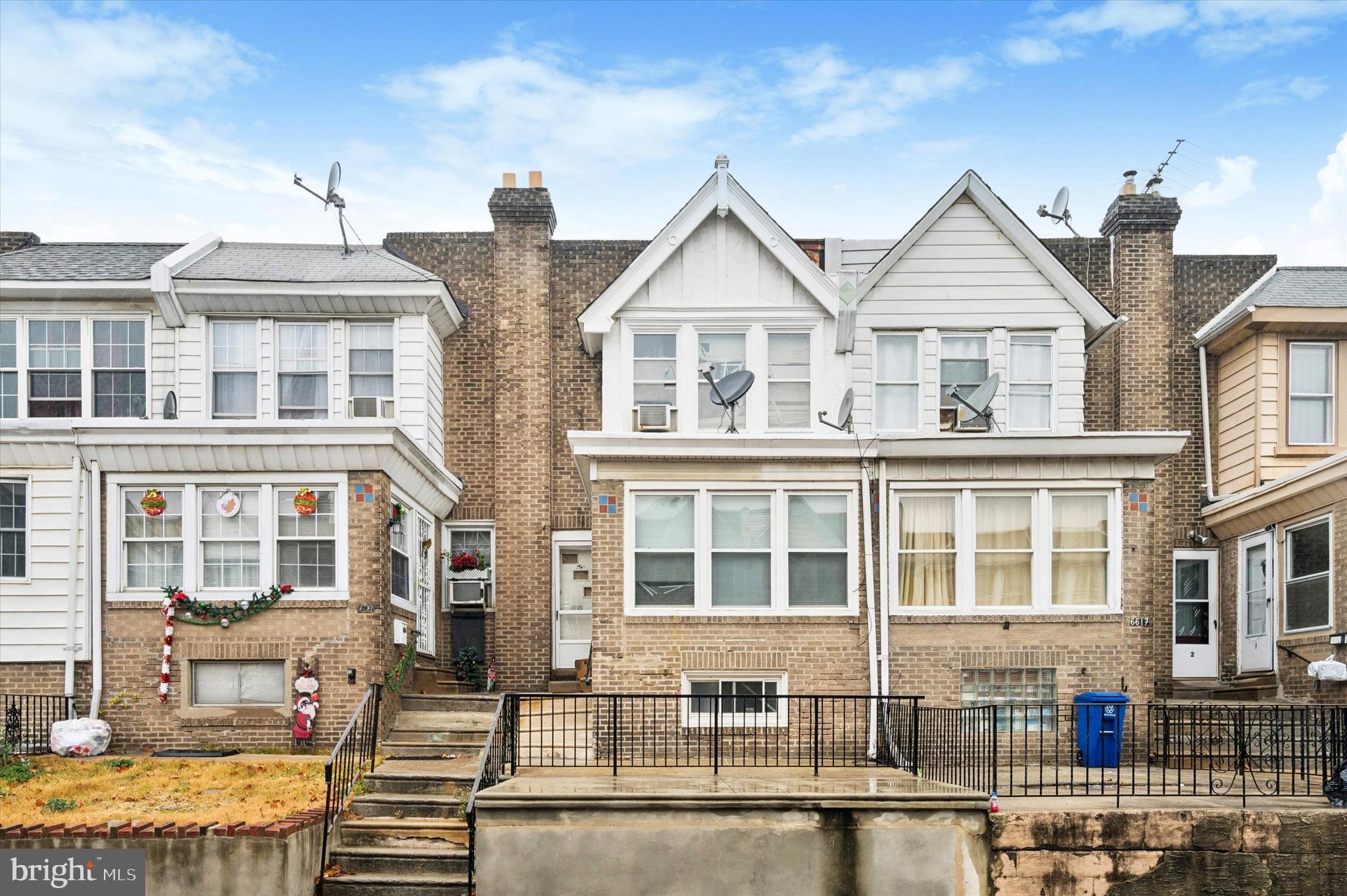 6619 Guyer Avenue, Unit 1 Philadelphia, PA 19142 - Photo 16 of 16 a front view of residential houses with street