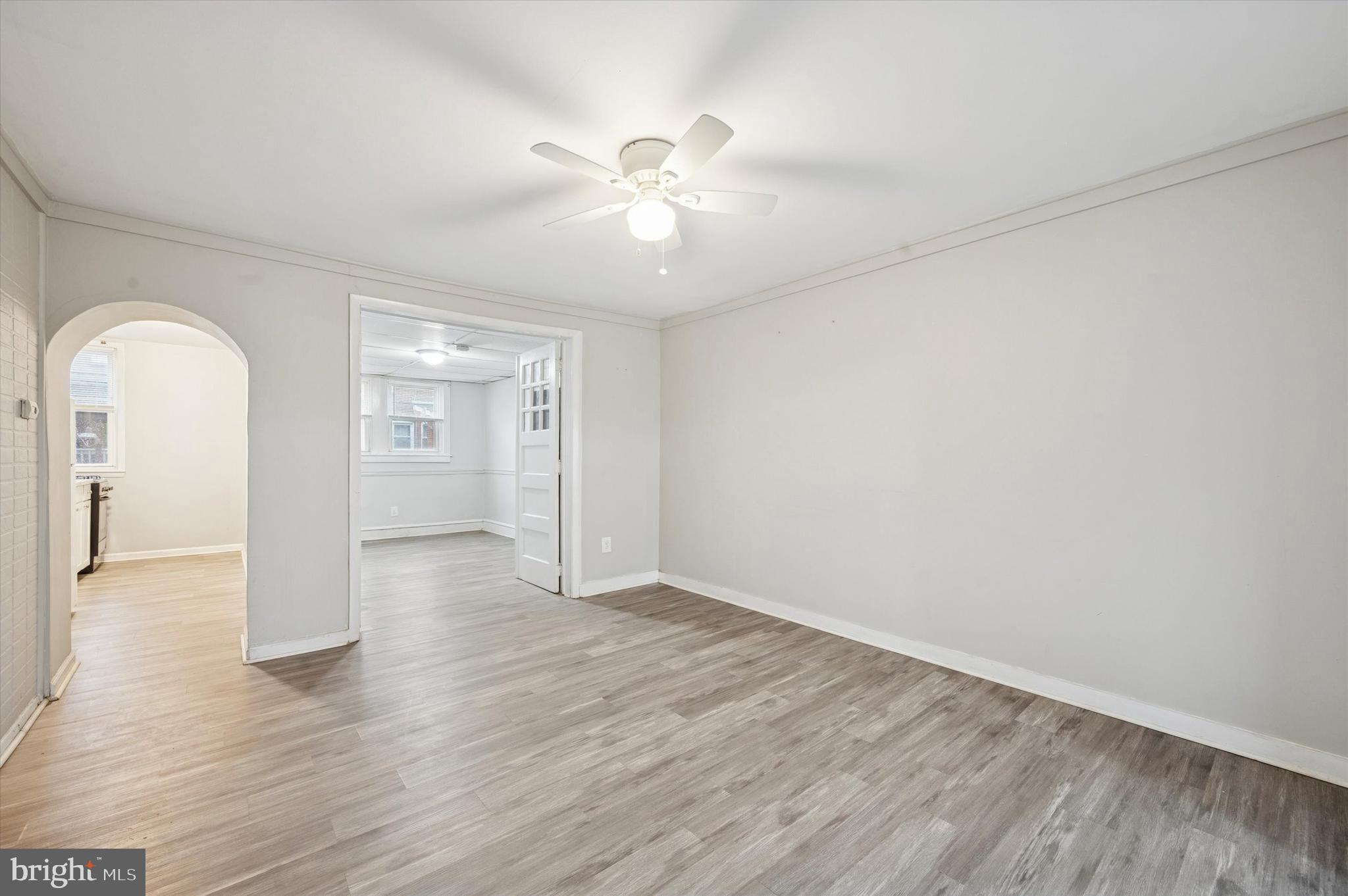 6619 Guyer Avenue, Unit 1 Philadelphia, PA 19142 - Photo 4 of 16 a view of an empty room with wooden floor