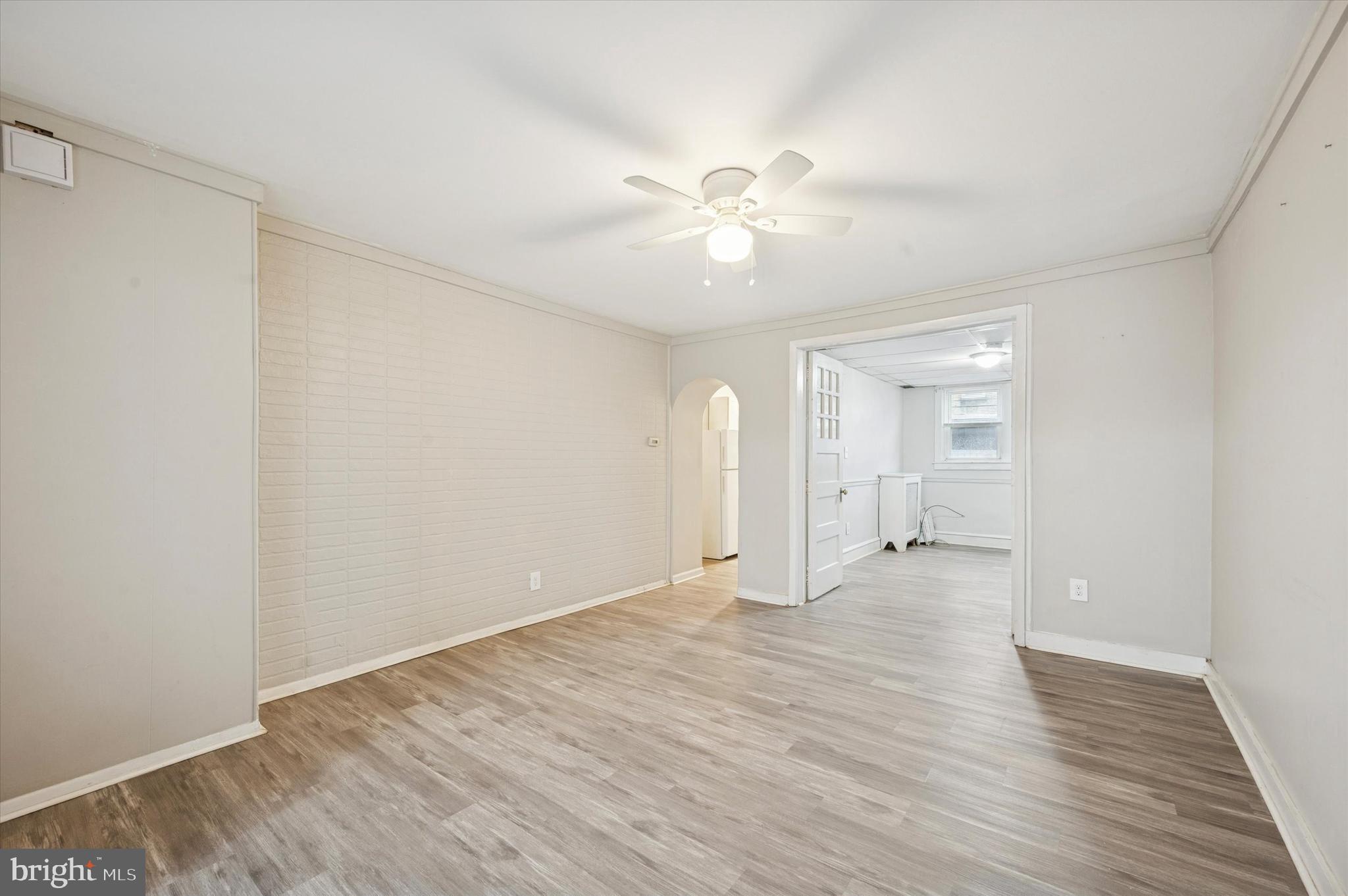 6619 Guyer Avenue, Unit 1 Philadelphia, PA 19142 - Photo 5 of 16 a view of an empty room with wooden floor