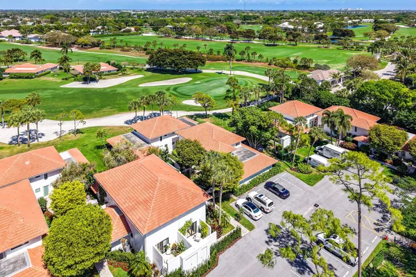 an aerial view of residential houses with outdoor space and street view