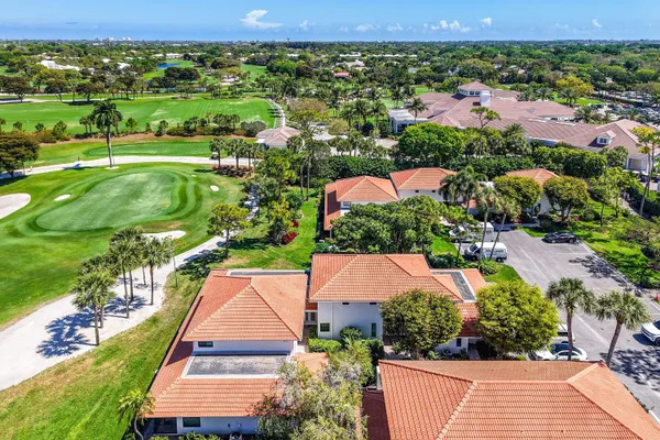 an aerial view of residential houses with outdoor space and street view