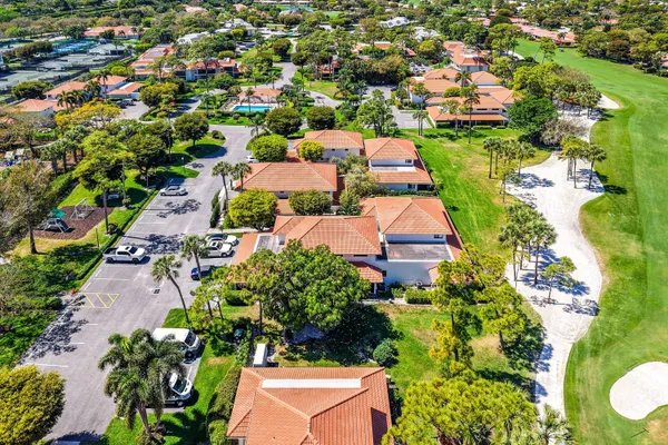 an aerial view of residential house with outdoor space and swimming pool