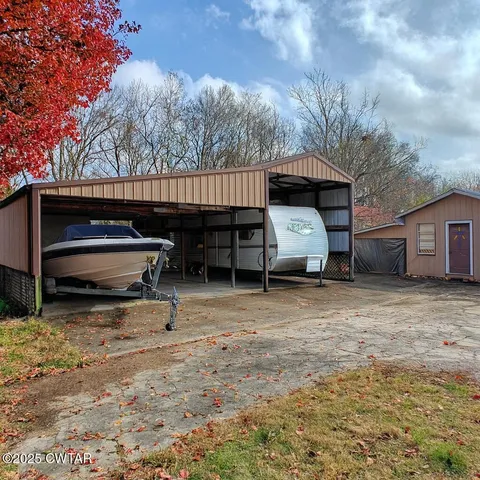 a view of backyard with barbeque grill and stove