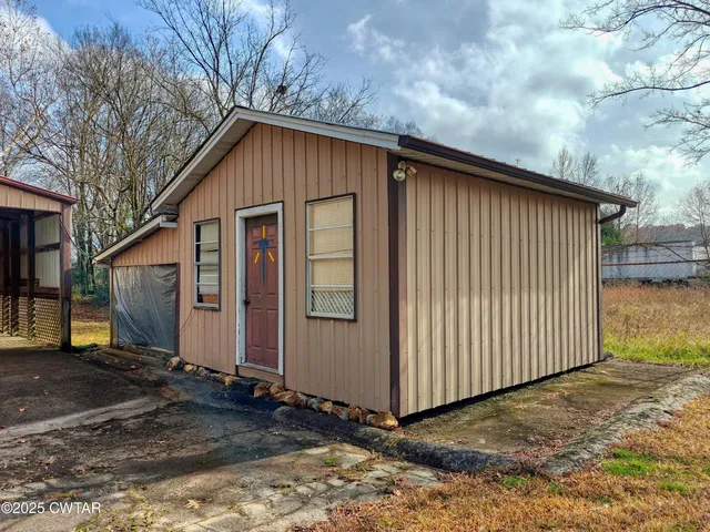 a view of a brick house with a large windows