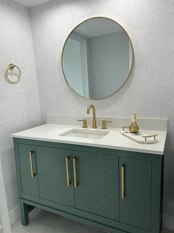a bathroom with a shower and a sink