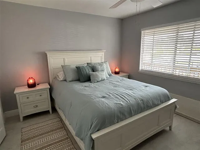 a bathroom with a sink a toilet a mirror and shower curtain