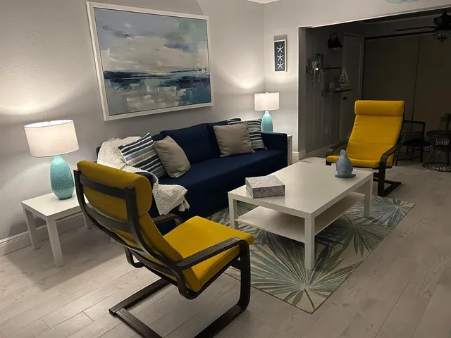 a dining room with a wooden table and chairs