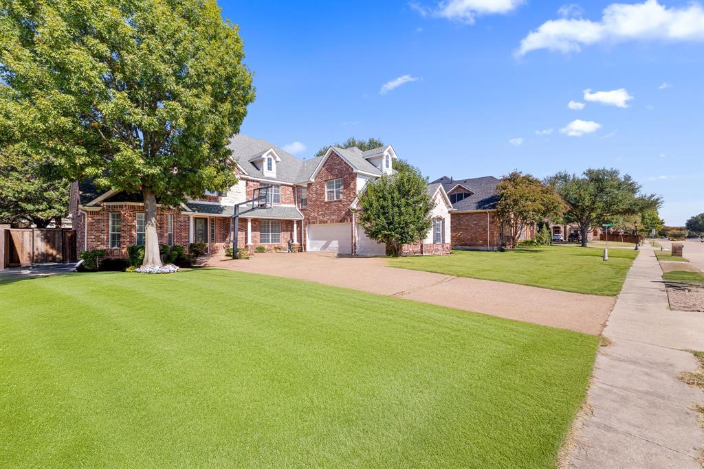 2021 Country Brook Lane Allen, TX 75002 - Photo 2 of 40 a view of a house with a big yard