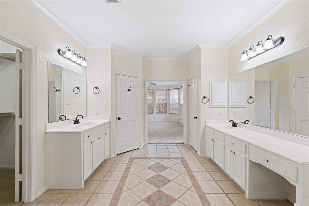 2021 Country Brook Lane Allen, TX 75002 - Photo 22 of 40 a spacious bathroom with a double vanity sink mirror and a bathtub
