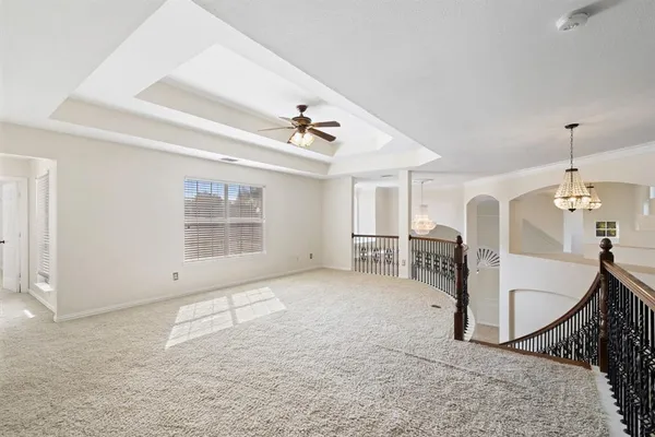 a view of a livingroom with furniture and hardwood floor