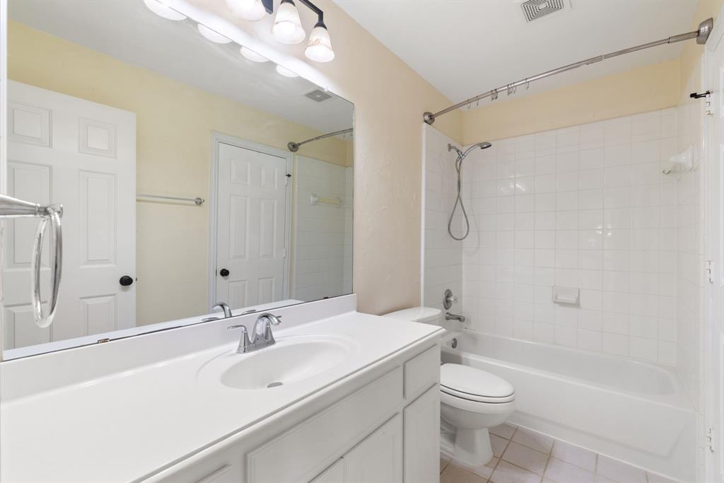 2021 Country Brook Lane Allen, TX 75002 - Photo 35 of 40 a bathroom with a sink a toilet and shower