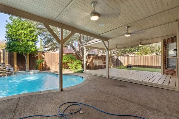 a view of swimming pool with yard