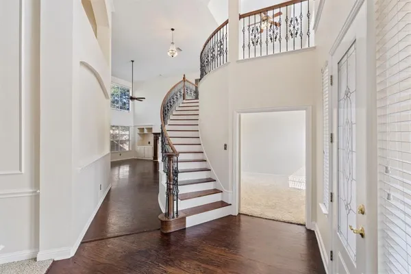a view of entryway with wooden floor