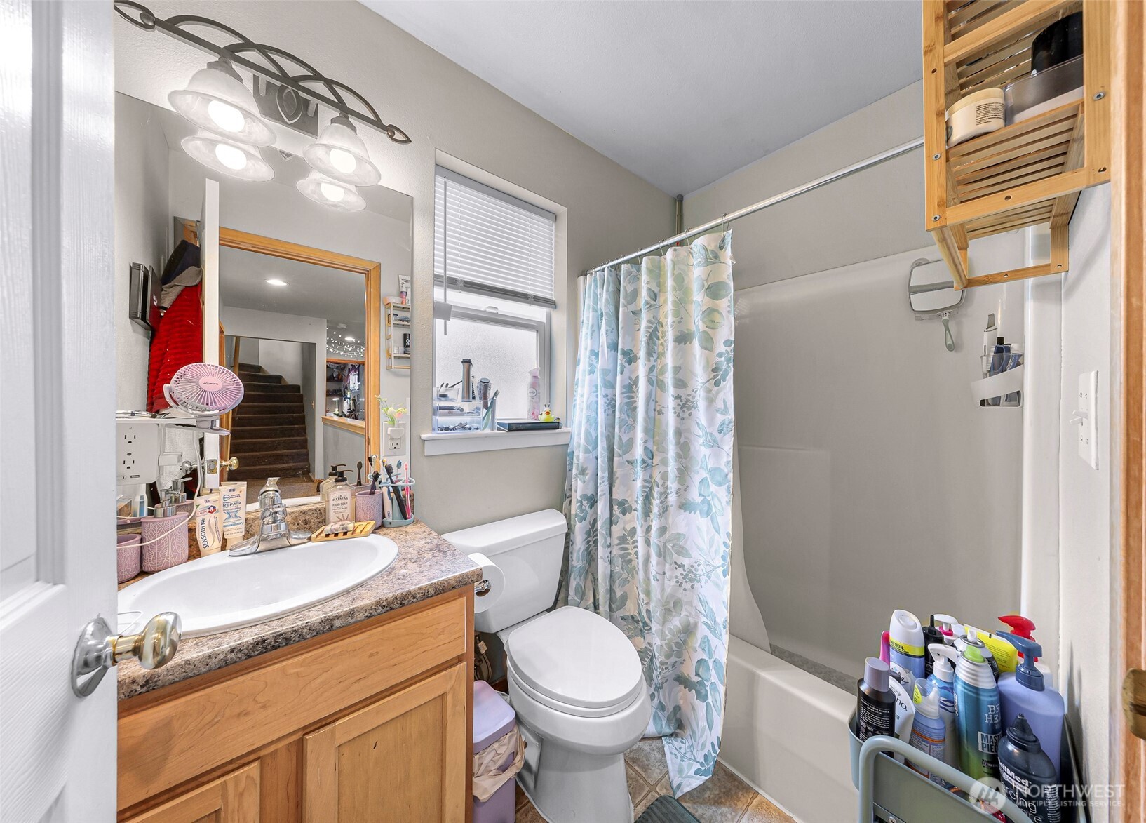 1121 22nd Street Bellingham, WA 98225 - Photo 19 of 34 a bathroom with a granite countertop sink toilet and shower