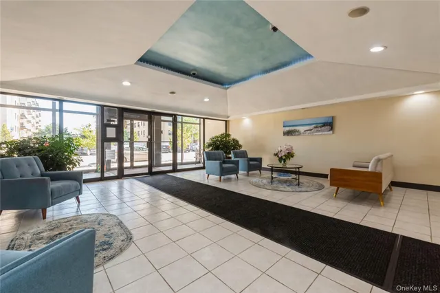 a large white kitchen with a large window