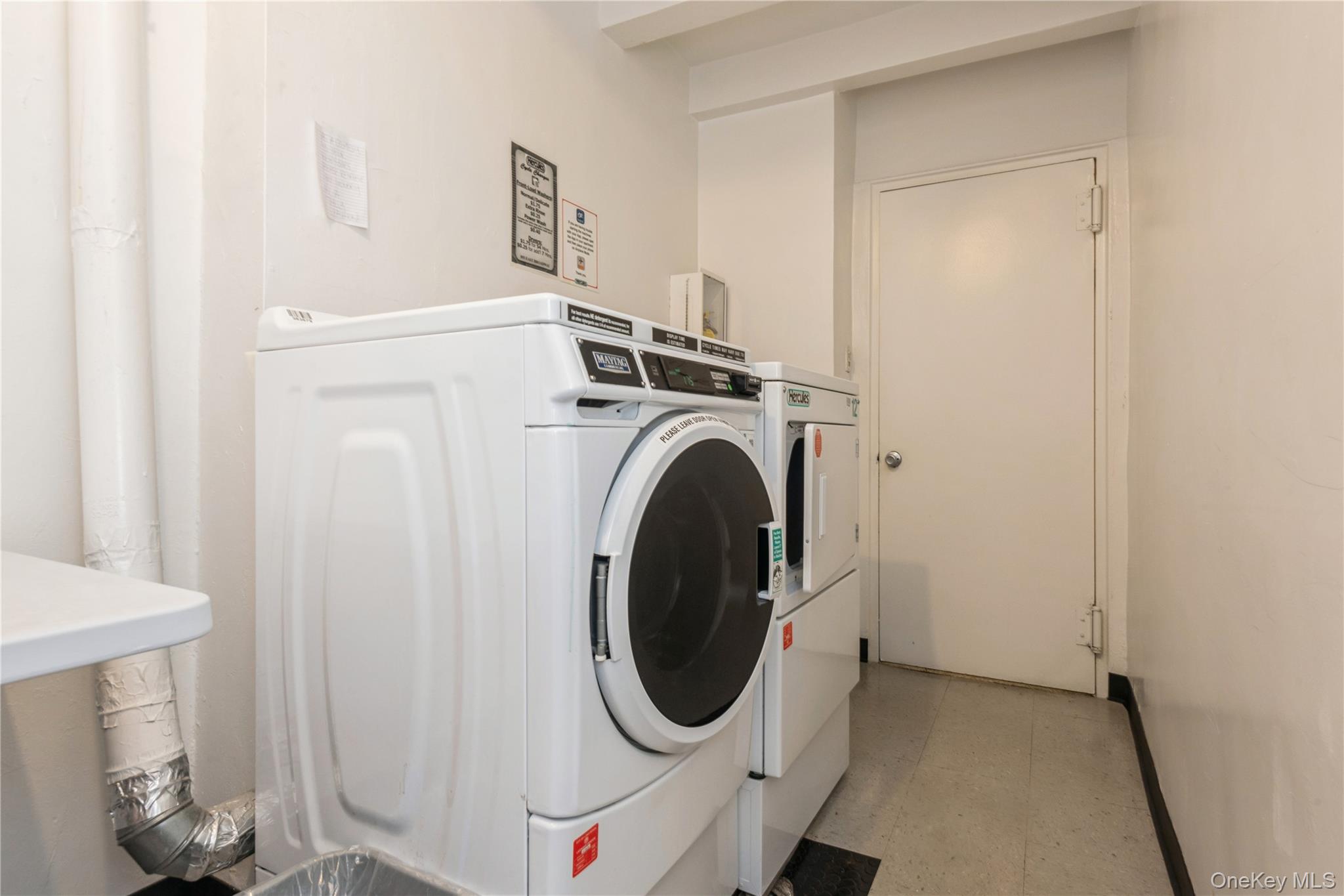 855 East Broadway, Unit LD Long Beach, NY 11561 - Photo 8 of 9 a utility room with dryer and washer