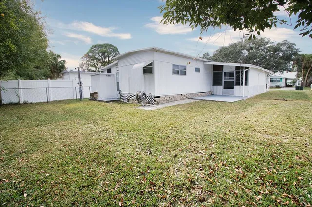 a view of a house with a yard and garage