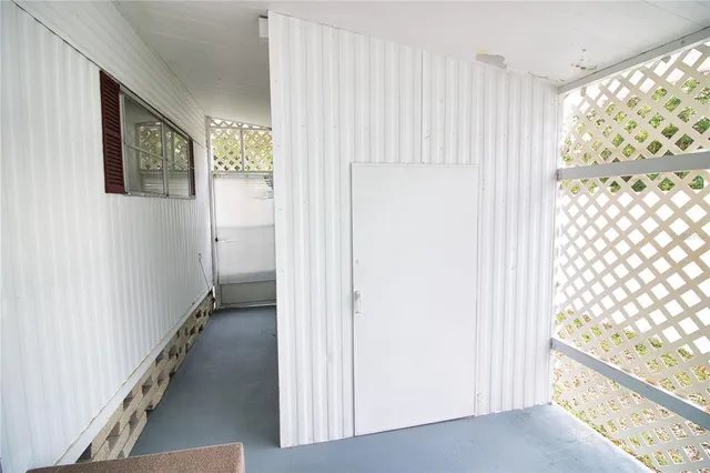 a view of hallway with windows