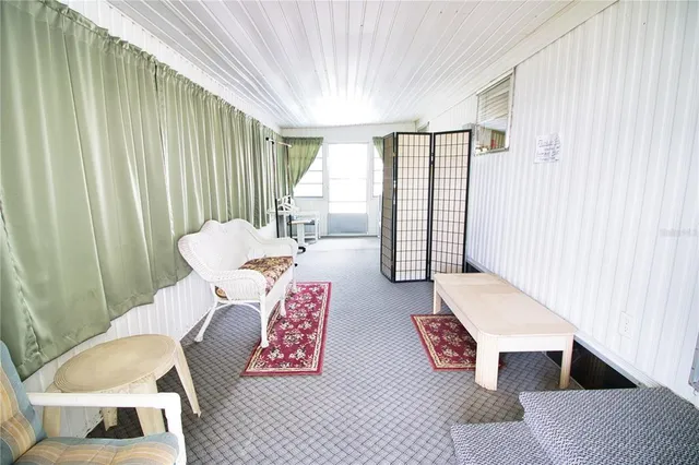 a living room with furniture and a rug