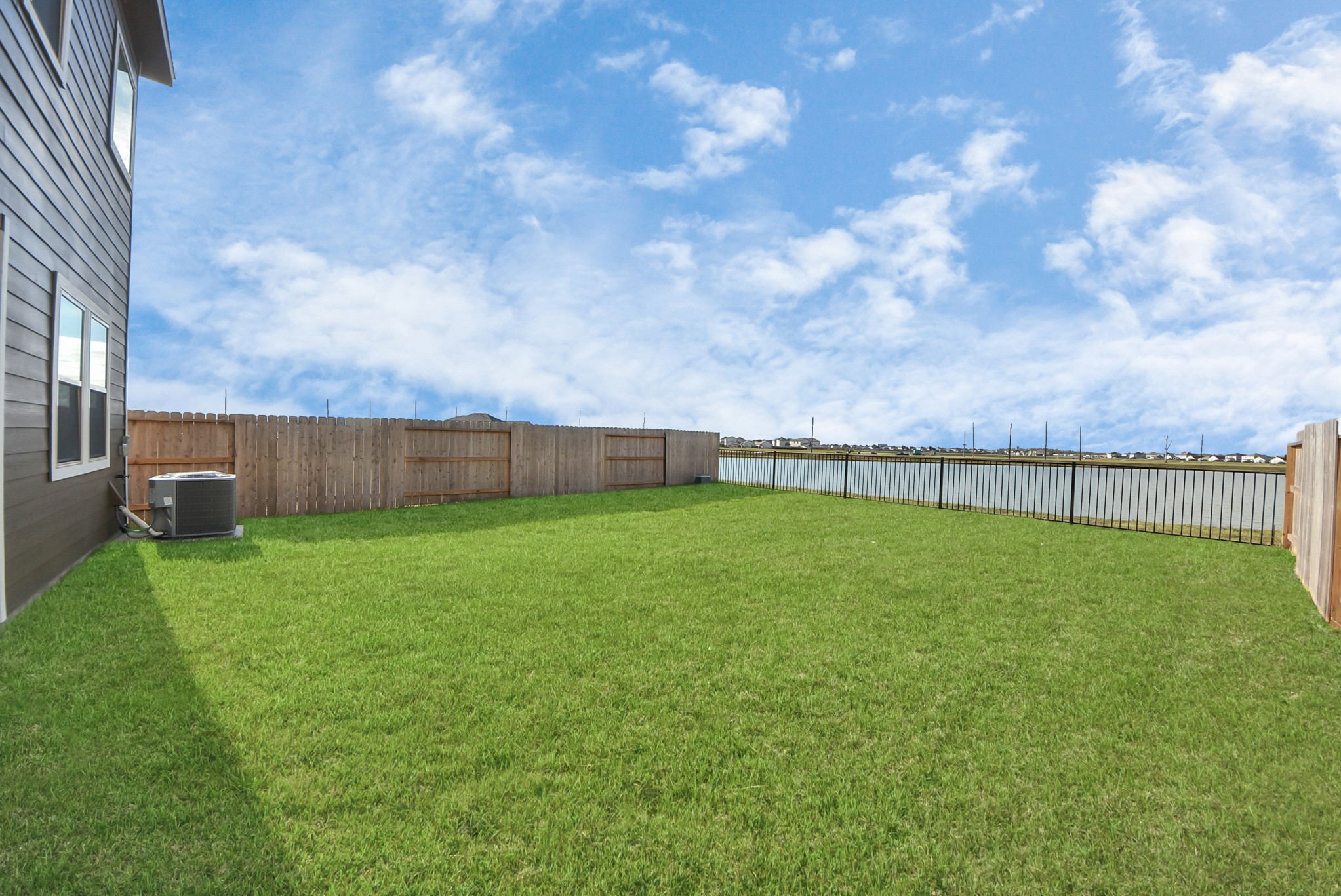 6522 Escondido Drive Rosharon, TX 77583 - Photo 30 of 33 Fully fenced back yard with patio, lake view, no back neighbors