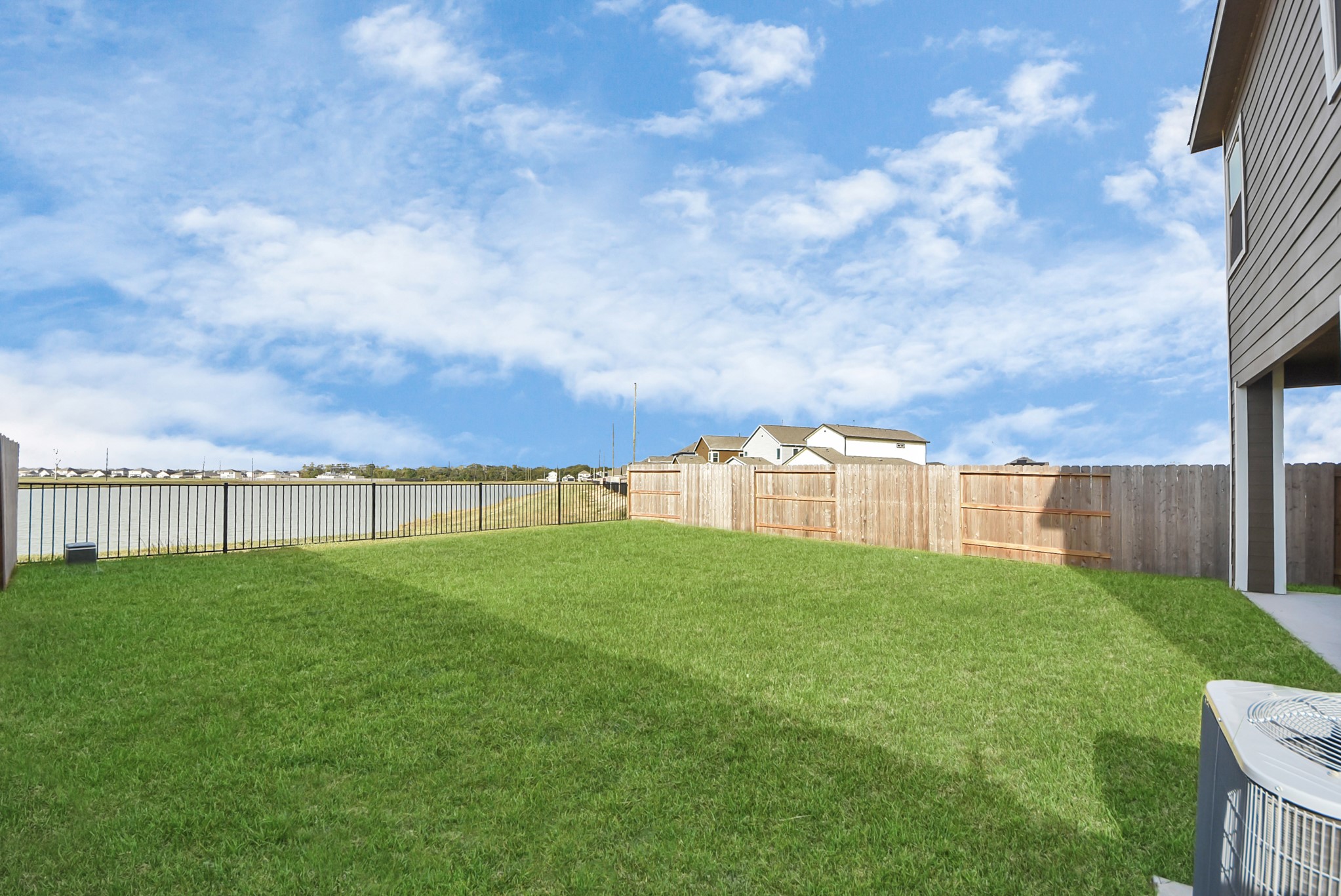 6522 Escondido Drive Rosharon, TX 77583 - Photo 32 of 33 Fully fenced back yard with patio, lake view, no back neighbors