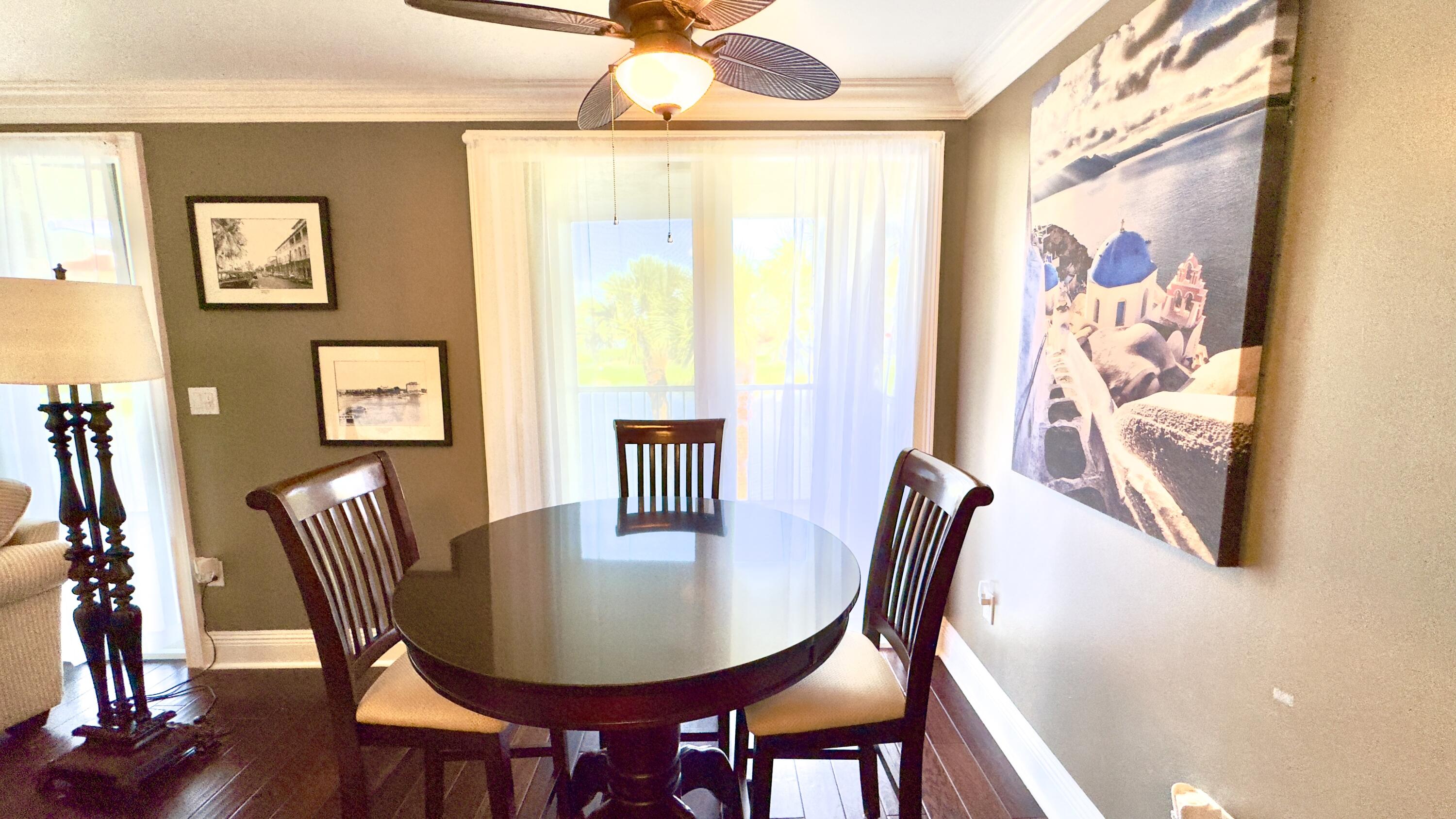 102 Half Moon Circle, Unit F2 Hypoluxo, FL 33462 - Photo 26 of 47 Breakfast area with water view