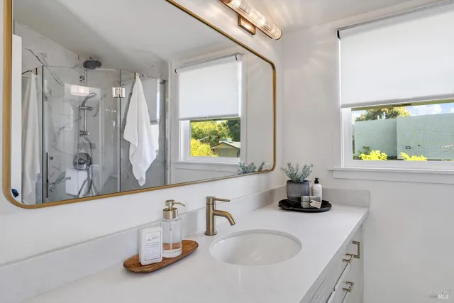 a bathroom with a sink and a mirror