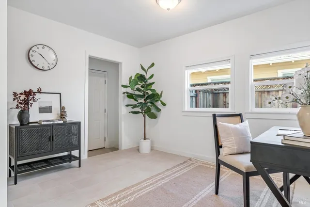 a workspace with furniture and a window