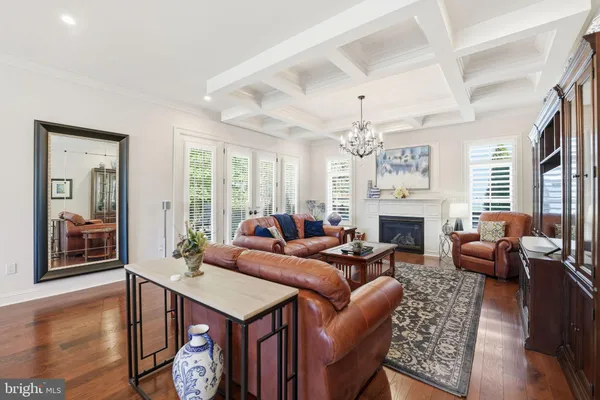a bedroom with a large bed and a fireplace