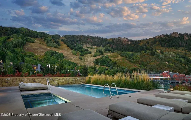 a view of a patio with table and chairs with wooden floor