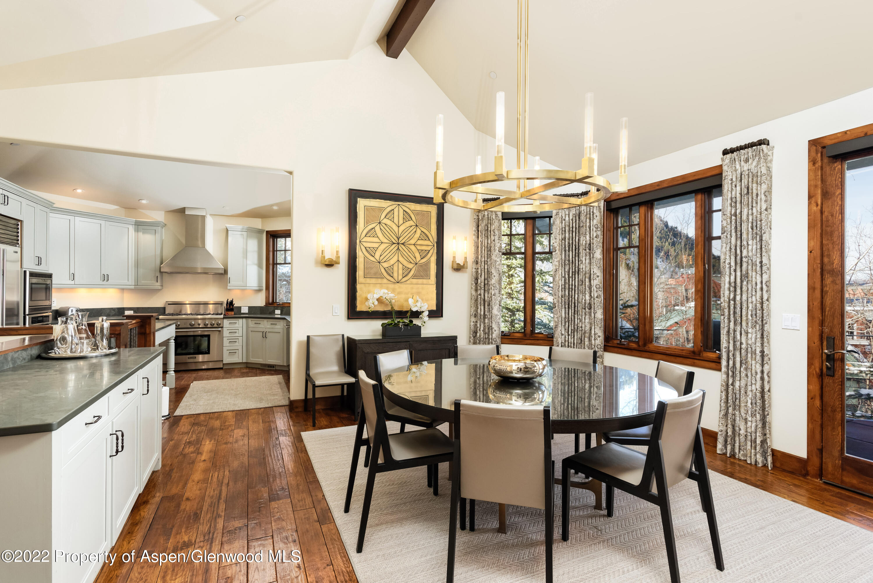 704 South Galena Street Aspen, CO 81611 - Photo 5 of 18 a large kitchen with a table and chairs
