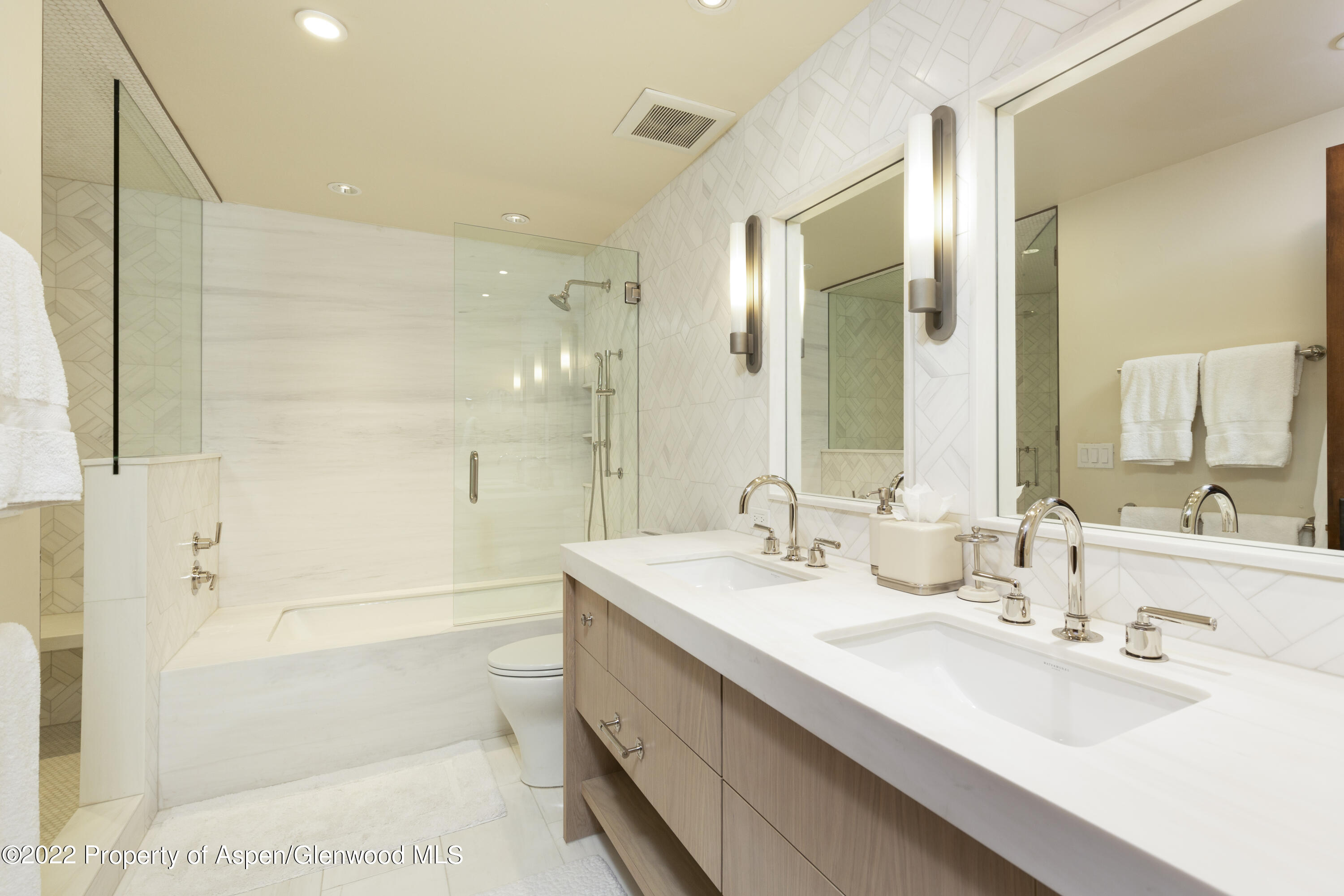 704 South Galena Street Aspen, CO 81611 - Photo 9 of 18 a bathroom with a double vanity sink mirror double and bathtub
