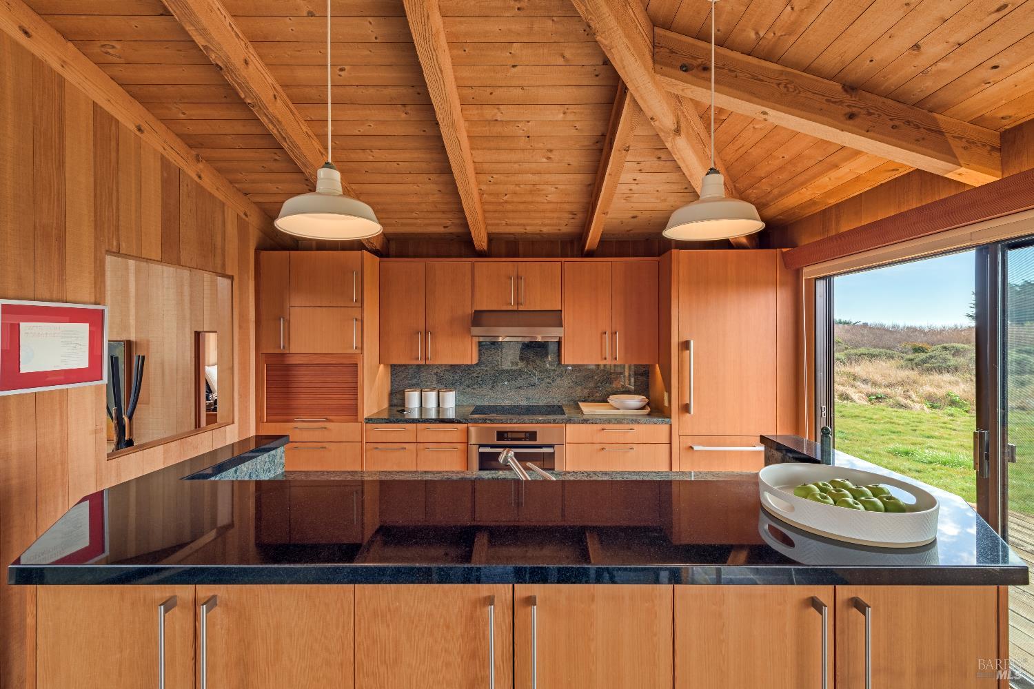 336 Pipers Reach The Sea Ranch, CA 95497 - Photo 4 of 15 Classic vertical grain Douglas fir kitchen with island and granite counter. Miele Induction Cooktop. Miele Built-In Oven. Breville Microwave. SubZero. Photo is staged from 2018.