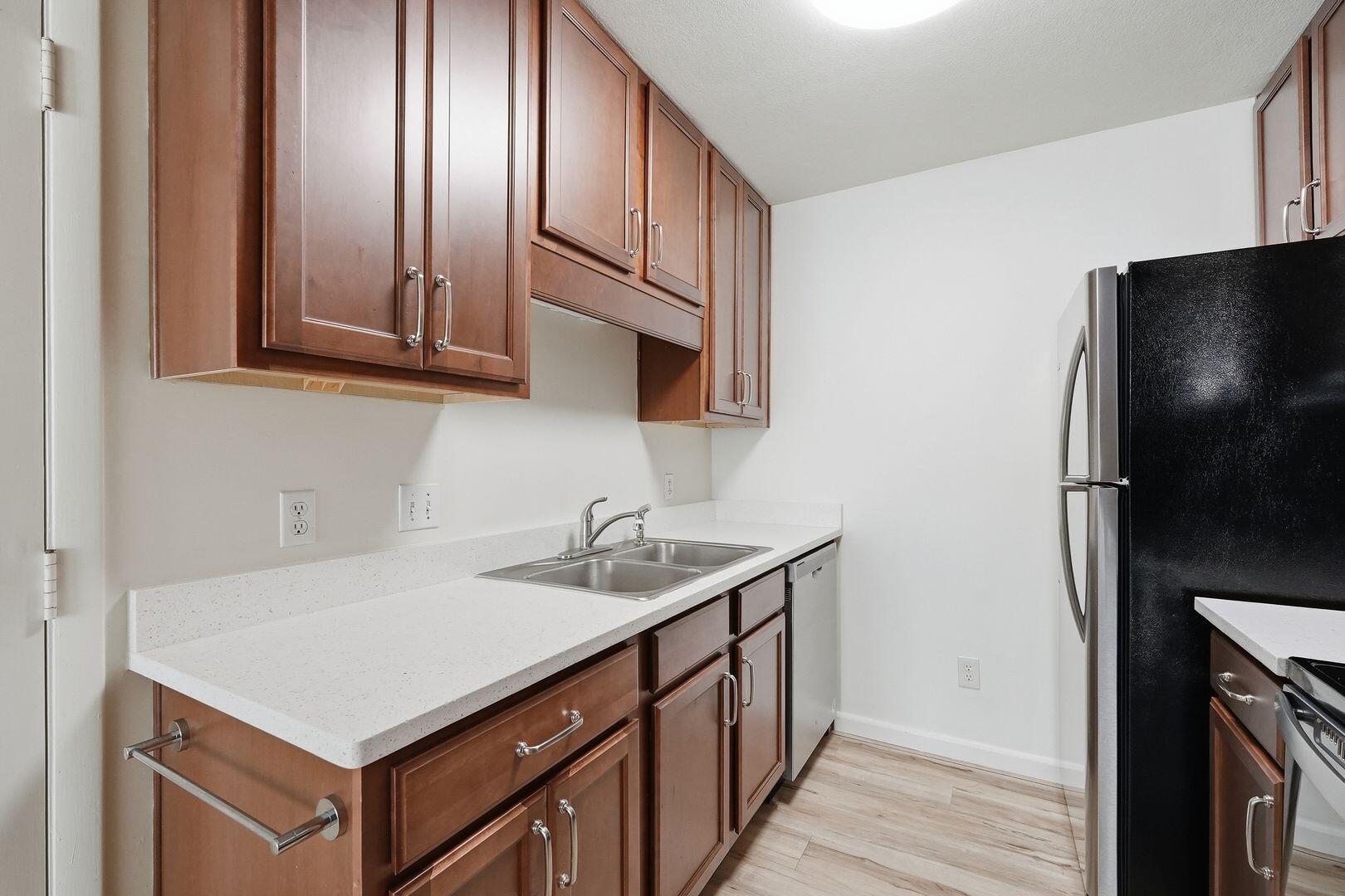5 Kelly Way Valparaiso, FL 32580 - Photo 14 of 31 a kitchen with a sink and a refrigerator