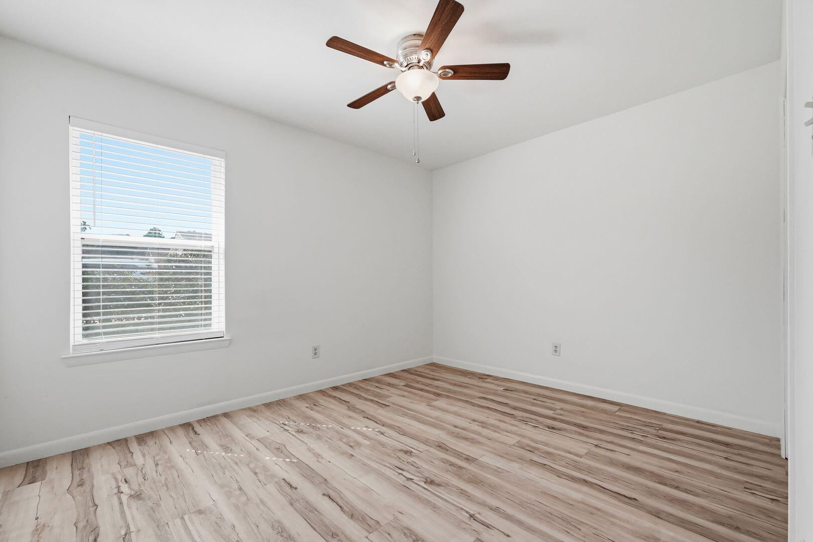 5 Kelly Way Valparaiso, FL 32580 - Photo 19 of 31 wooden floor in an empty room with a window