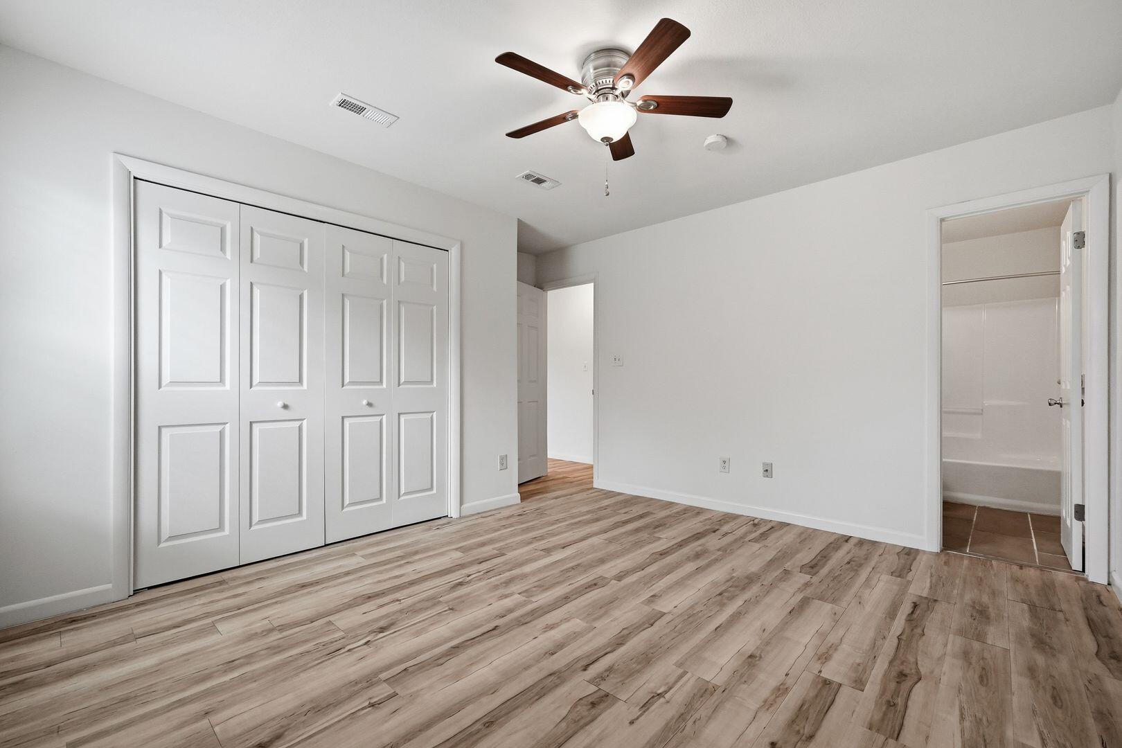 5 Kelly Way Valparaiso, FL 32580 - Photo 22 of 31 an empty room with wooden floor and windows