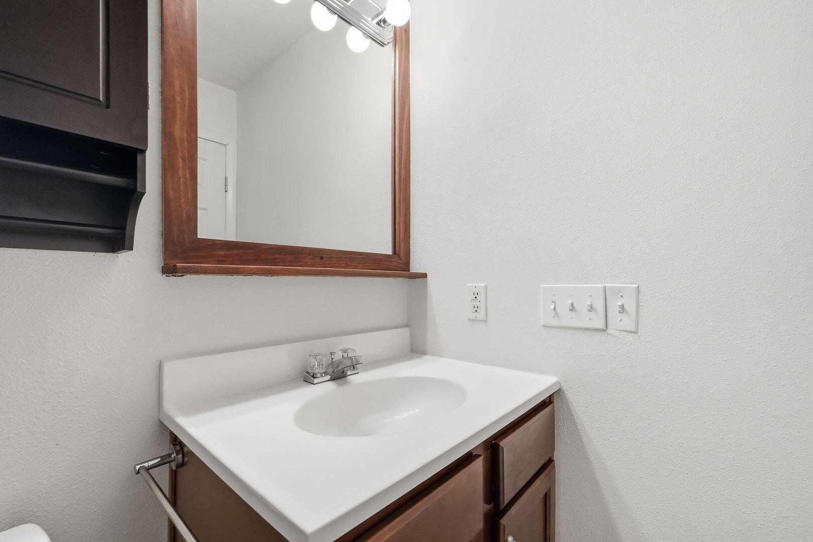 5 Kelly Way Valparaiso, FL 32580 - Photo 23 of 30 a bathroom with a sink and a mirror