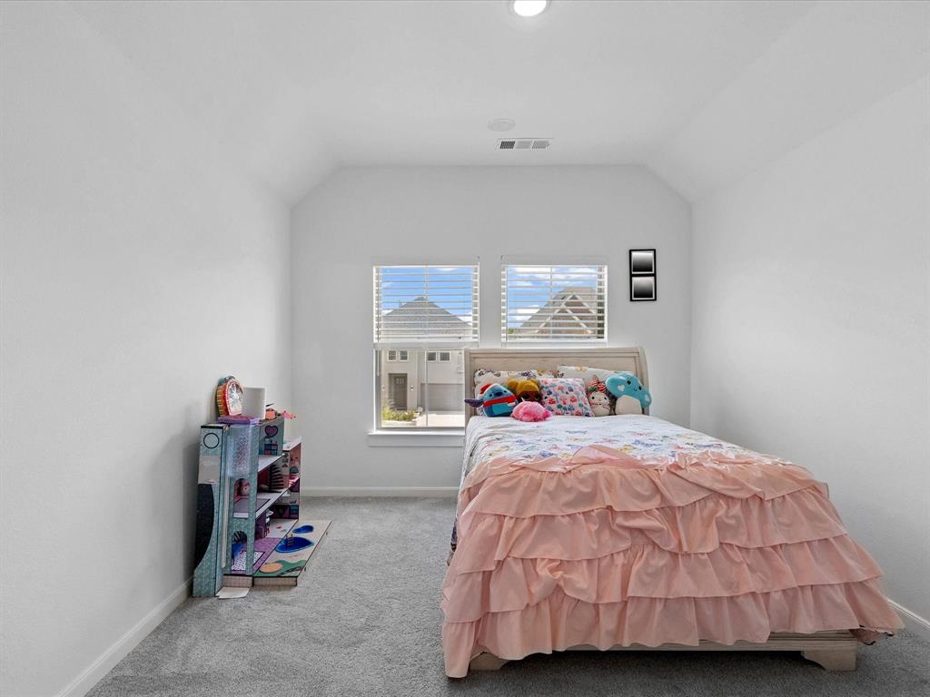 4828 Celestial Road McKinney, TX 75071 - Photo 18 of 25 a bedroom with a bed and a window