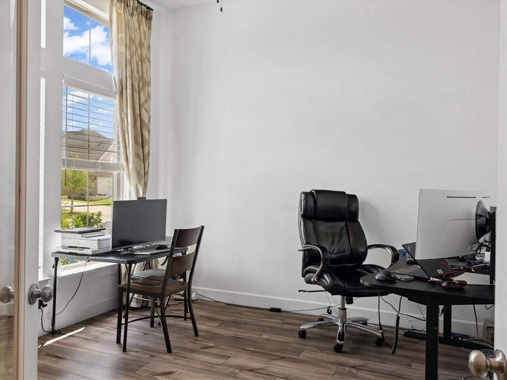 4828 Celestial Road McKinney, TX 75071 - Photo 5 of 25 a view of a workspace with furniture and a window