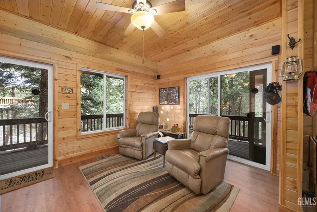 a outdoor living space with patio furniture and wooden floor