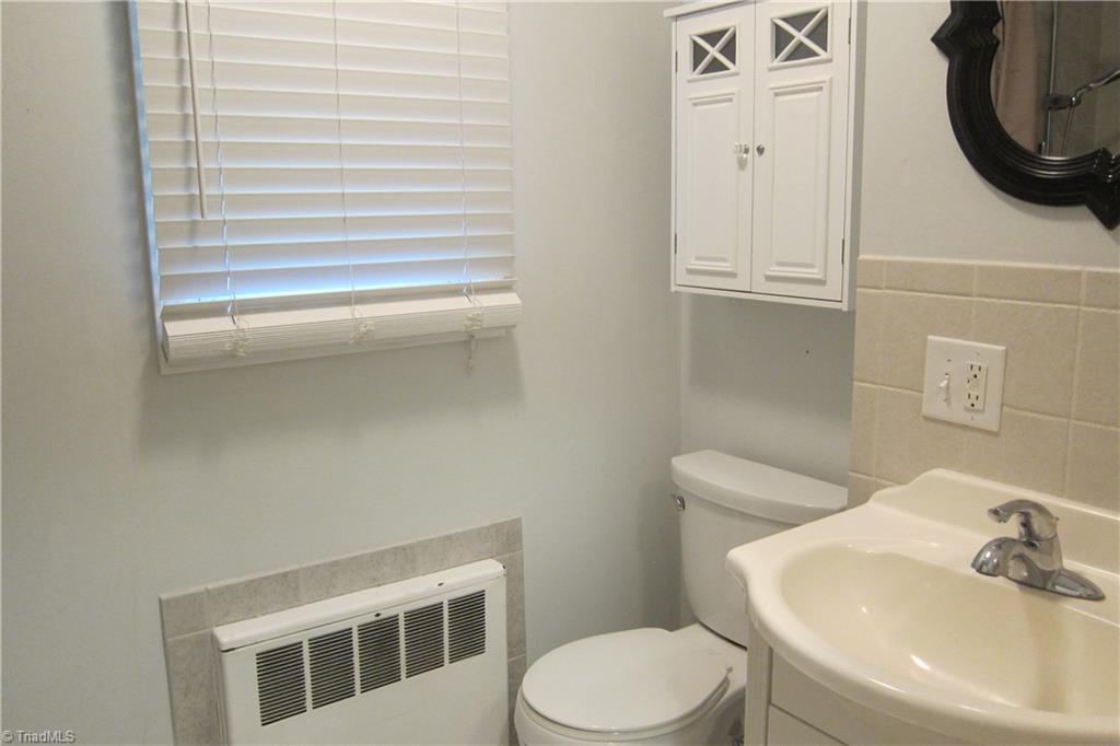 2419 Oak Ridge Road Oak Ridge, NC 27310 - Photo 12 of 30 Master Bath with upgraded vanity, toilet, large ceramic tile shower.