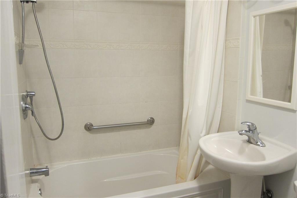 2419 Oak Ridge Road Oak Ridge, NC 27310 - Photo 15 of 30 Hall bath ceramic tile tub surround.