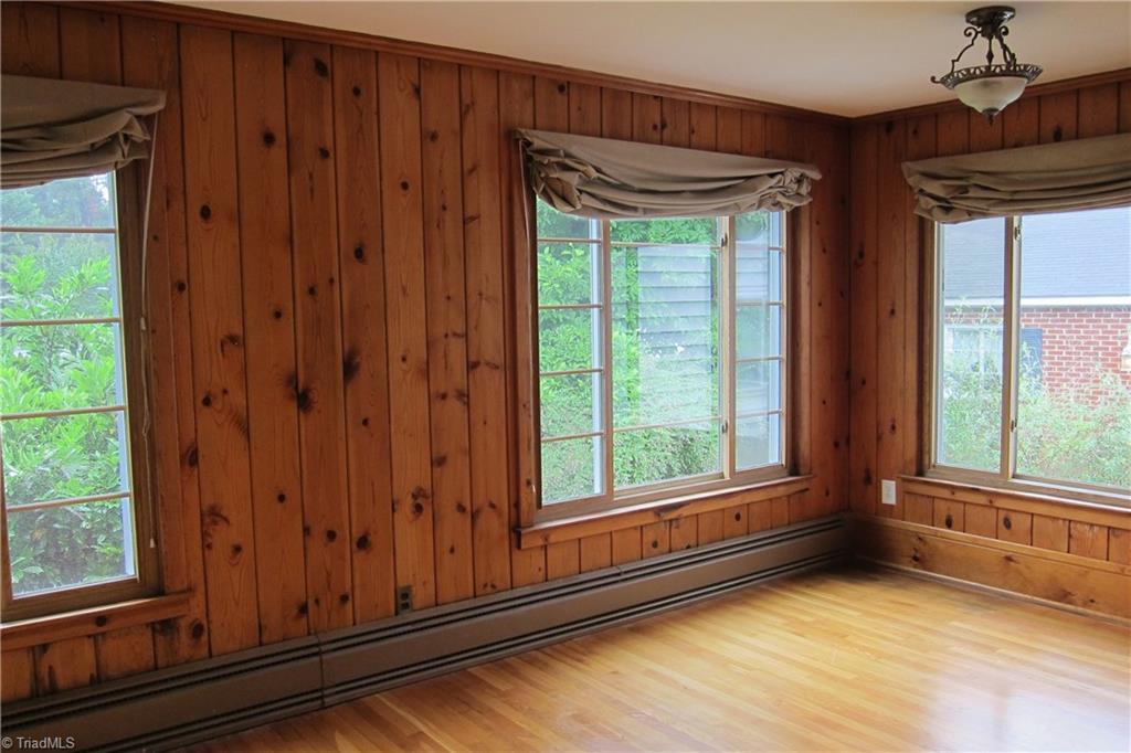 2419 Oak Ridge Road Oak Ridge, NC 27310 - Photo 18 of 30 Office with Nostalgic Knotty Pine Walls...wood floors... Large enough for two and wonderful natural light!