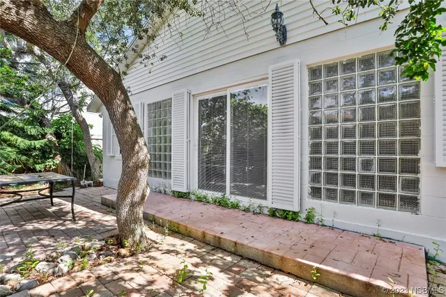 a front view of house with yard outdoor seating and barbeque oven