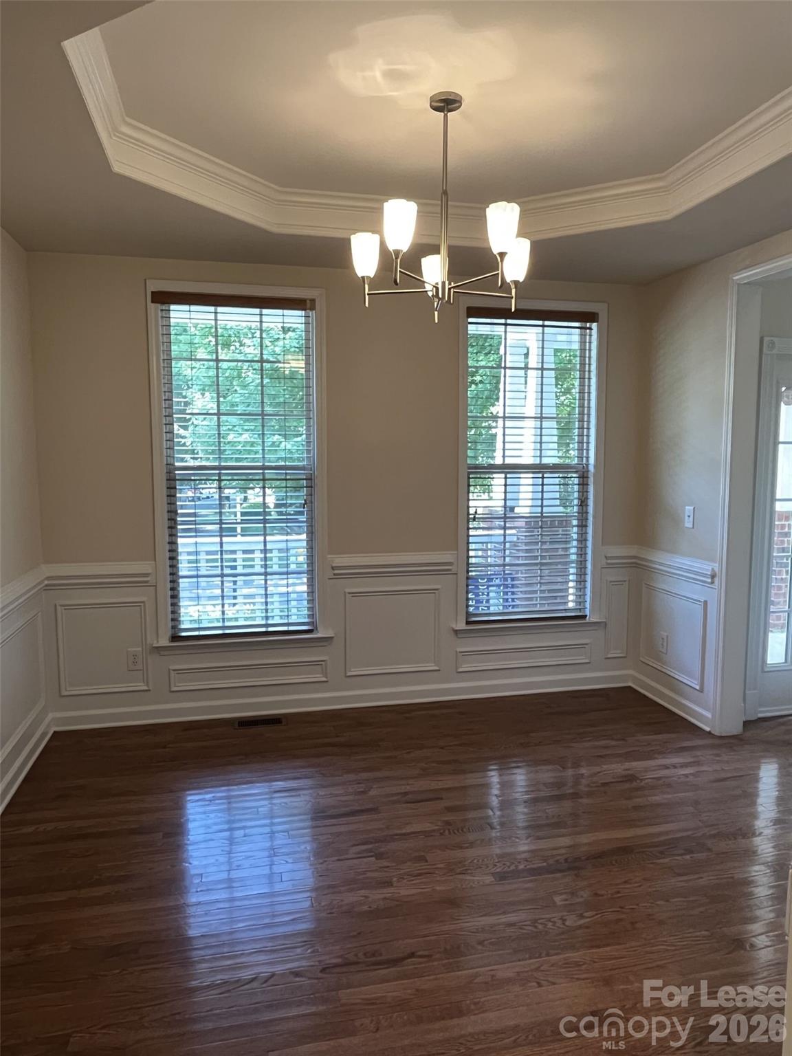 8531 Camberly Road Huntersville, NC 28078 - Photo 13 of 32 an empty room with wooden floor and windows
