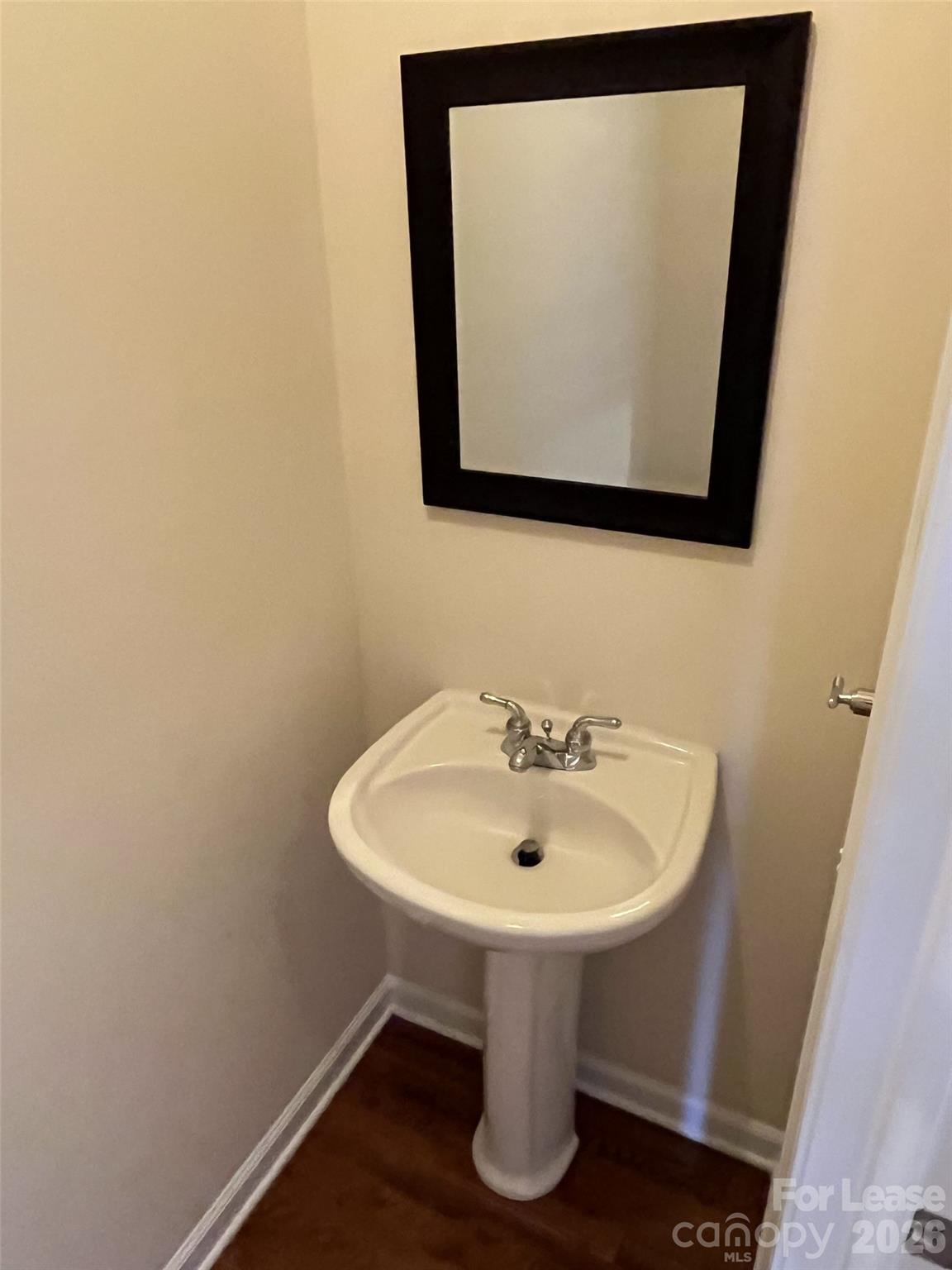 8531 Camberly Road Huntersville, NC 28078 - Photo 14 of 32 a bathroom with a sink and a mirror