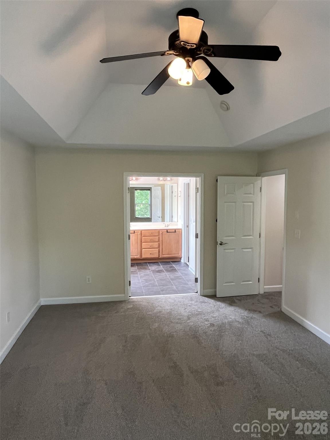 8531 Camberly Road Huntersville, NC 28078 - Photo 16 of 32 an empty room with chandelier fan and windows