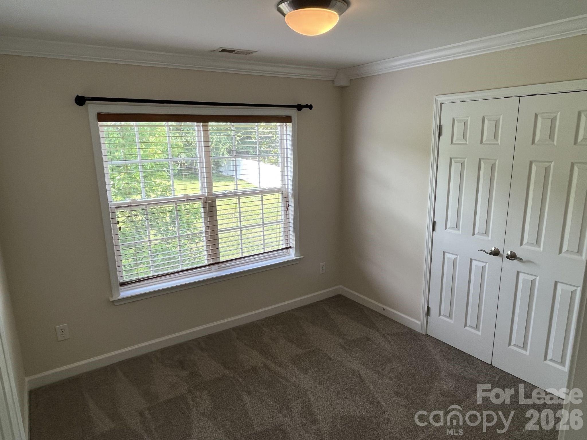 8531 Camberly Road Huntersville, NC 28078 - Photo 21 of 32 a view of an empty room with a window